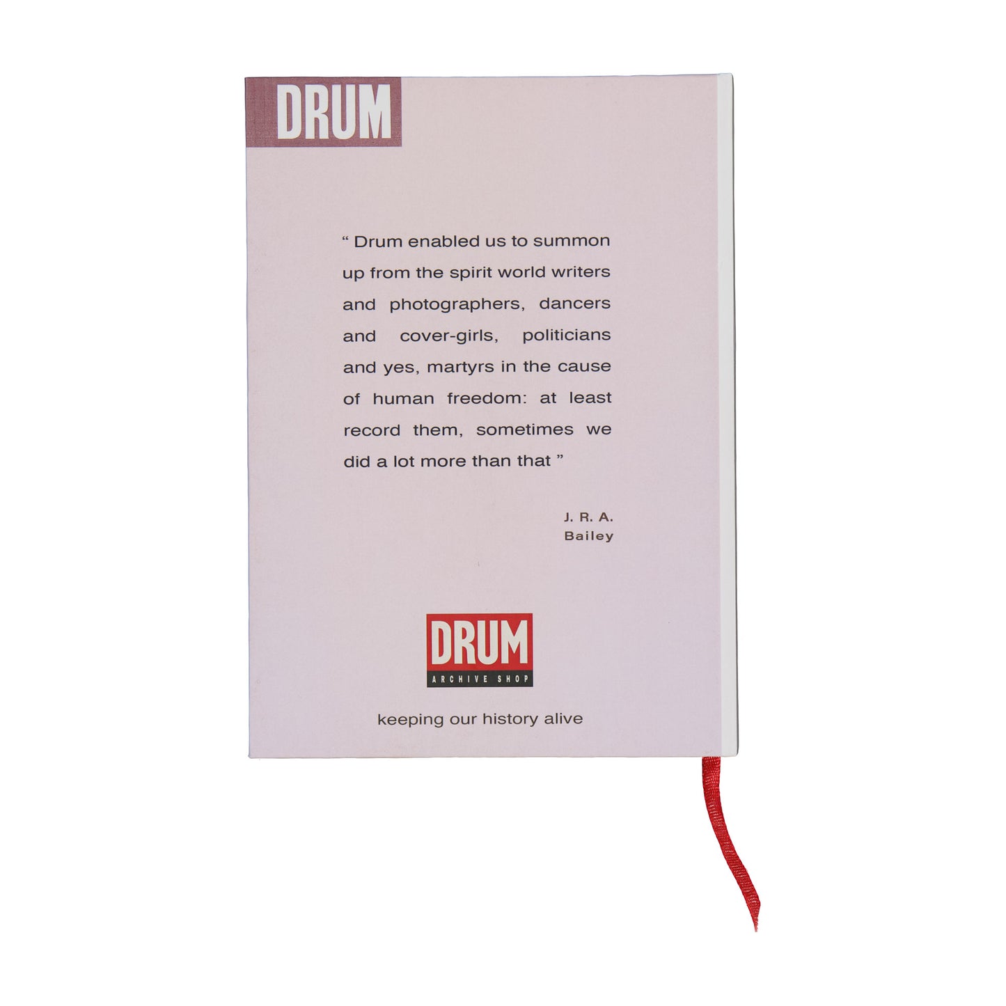 Book with text and 'DRUM' branding on a white background