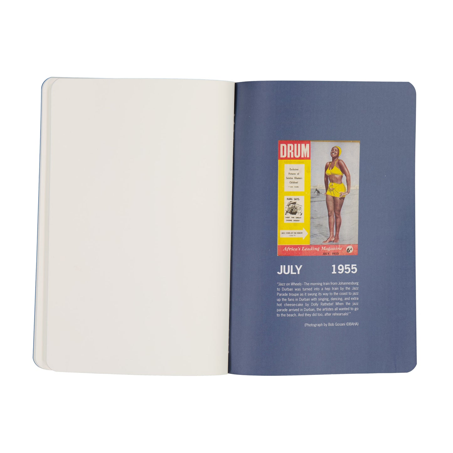 Open notebook with a vintage magazine page featuring a woman in a swimsuit from July 1955.