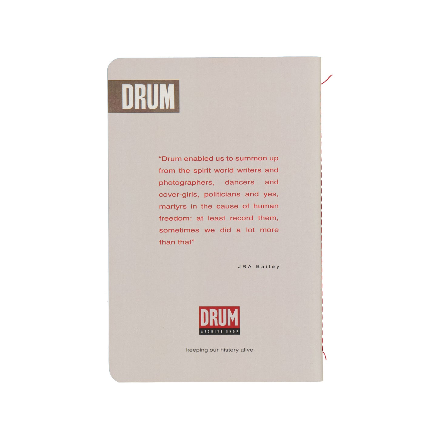 Notebook with 'DRUM' branding and text on a white background