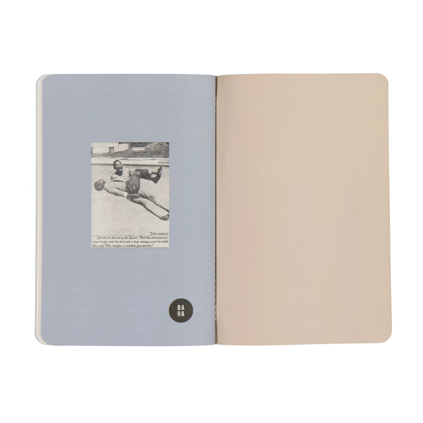 Open notebook with a photo on one page and plain beige on the other, on a white background.