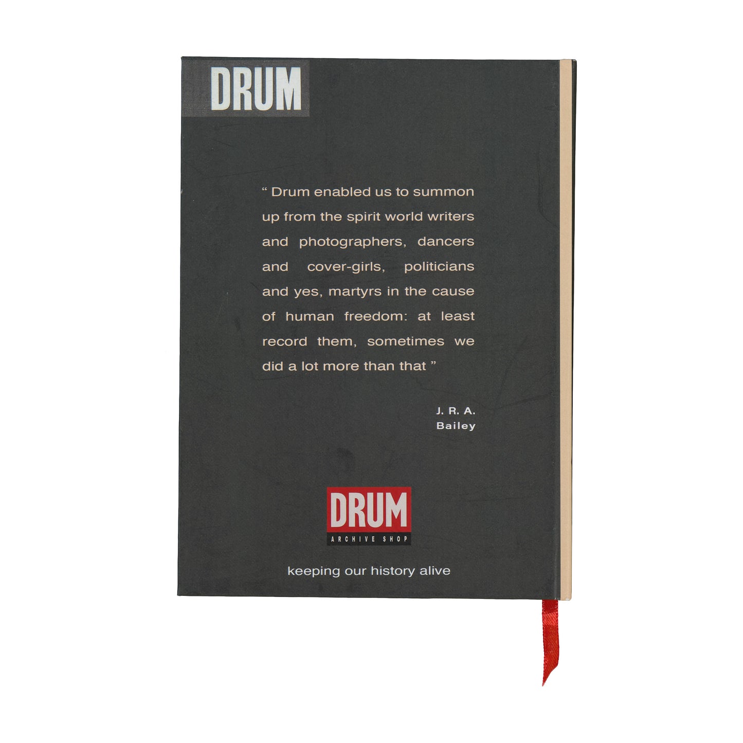 Black notebook with 'DRUM' branding and text on a white background