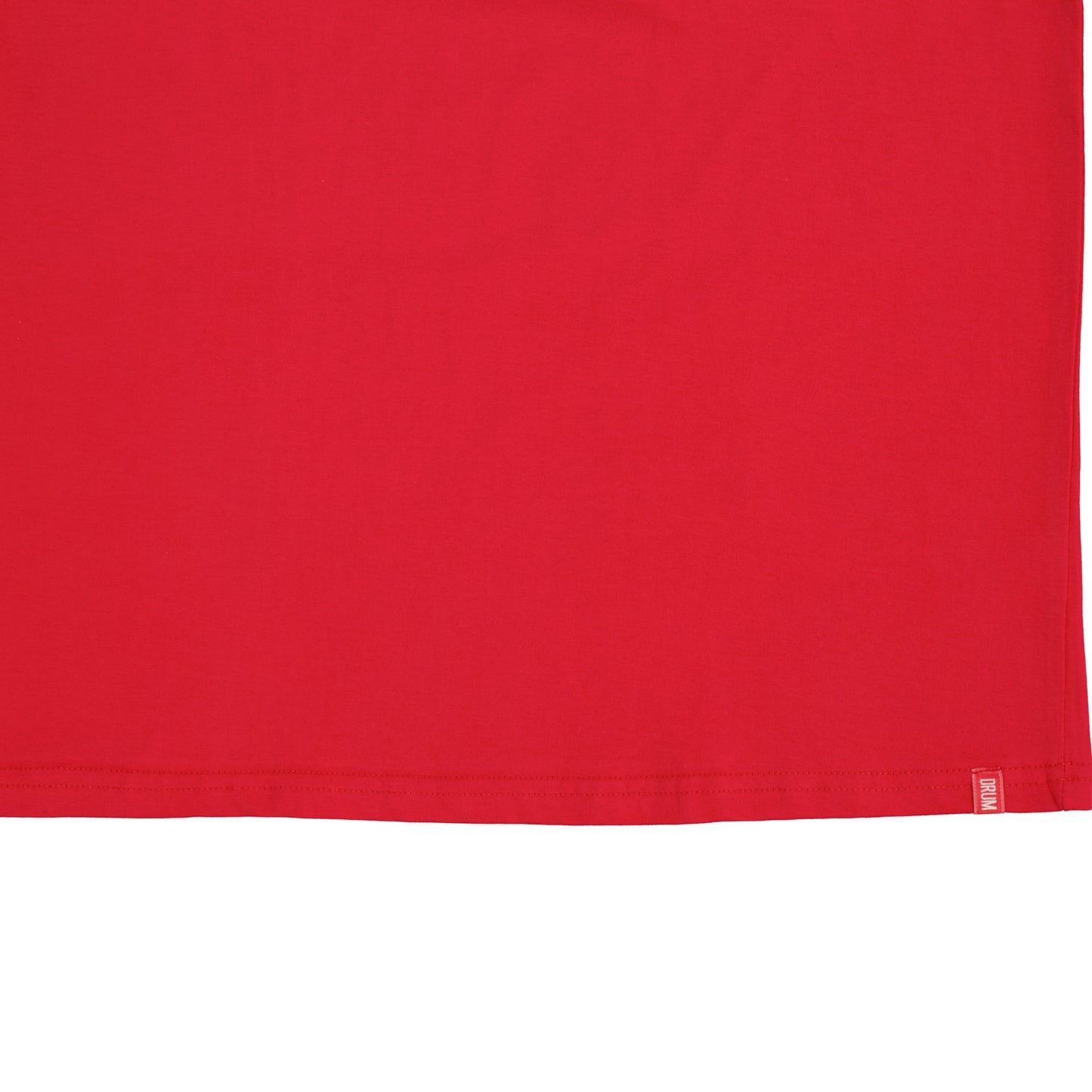 Close-up of a red fabric with a brand label on a white background