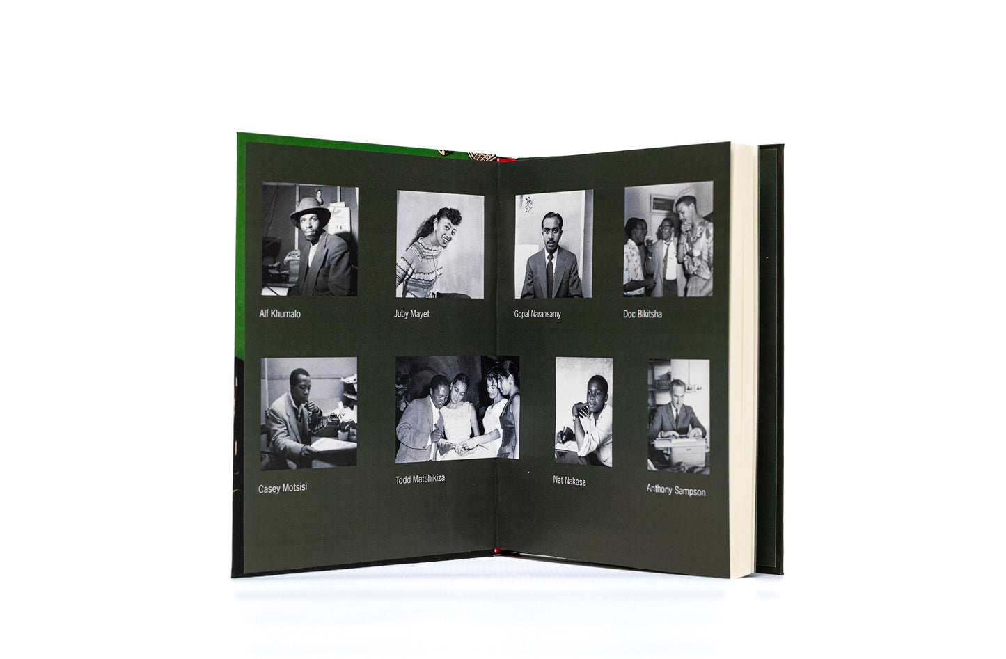 Open book with black and white photographs on a white background