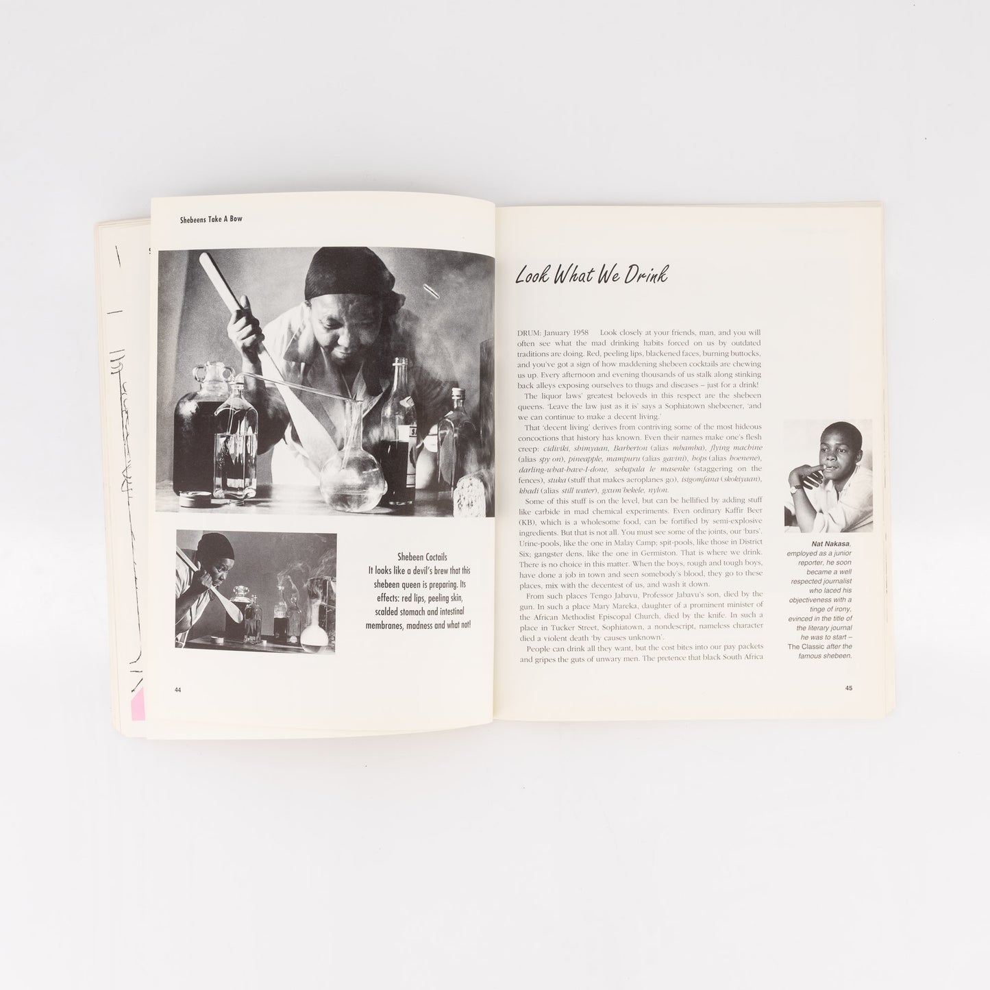 Open book with black and white photos and text on a white background