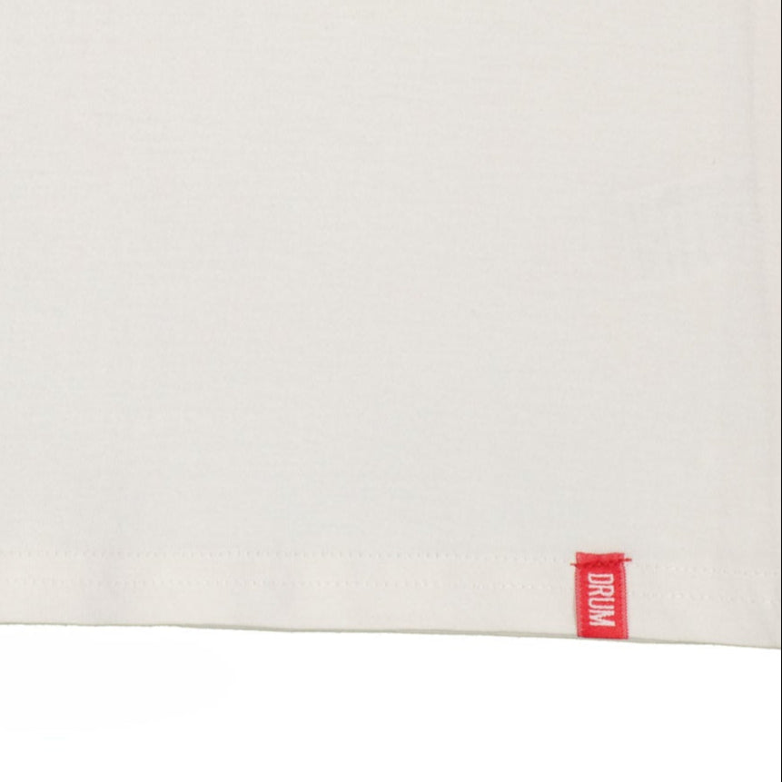 White surface with a red 'DRUM' label on a white background