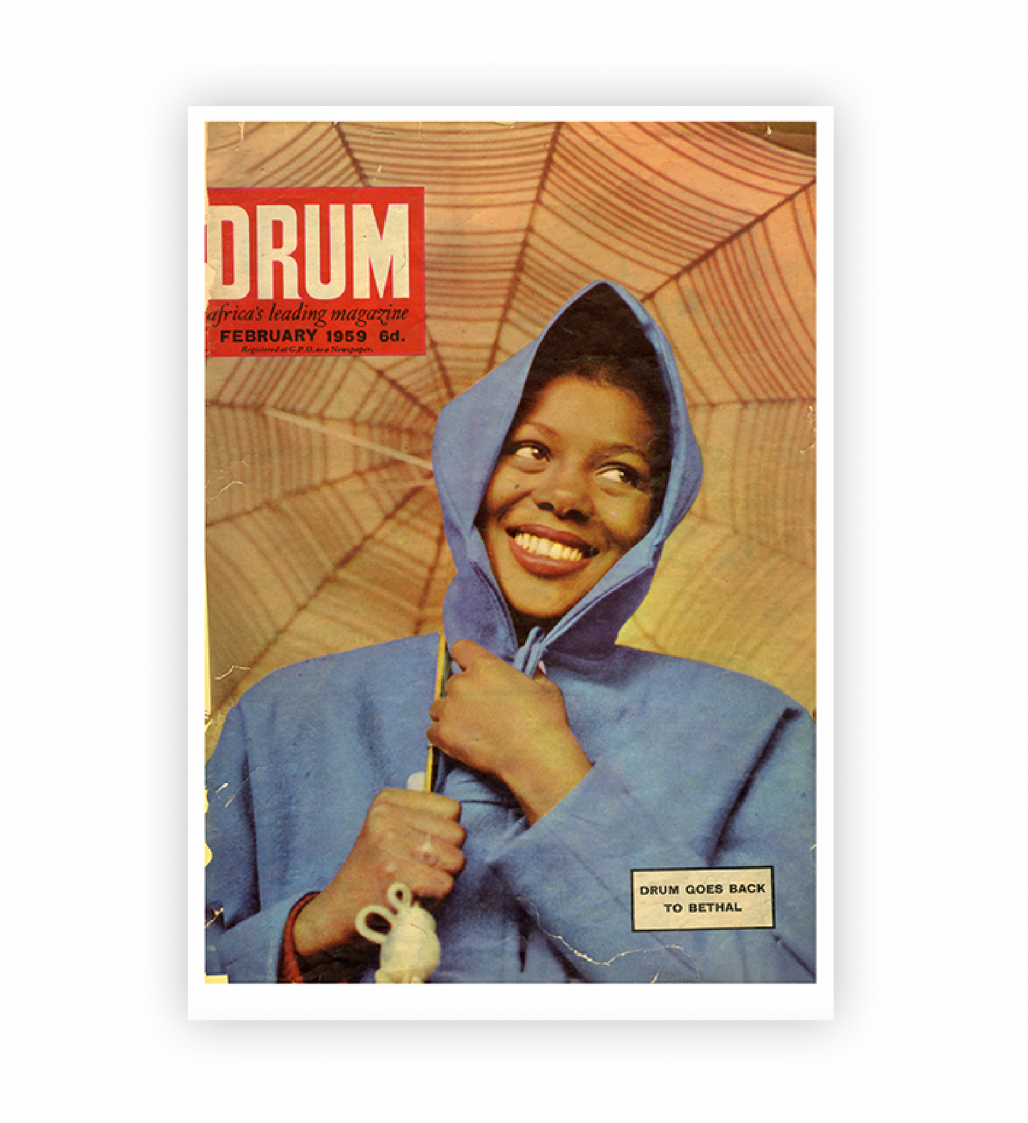 Vintage magazine cover with a person in a blue hooded coat holding an umbrella, featuring the 'DRUM' logo.