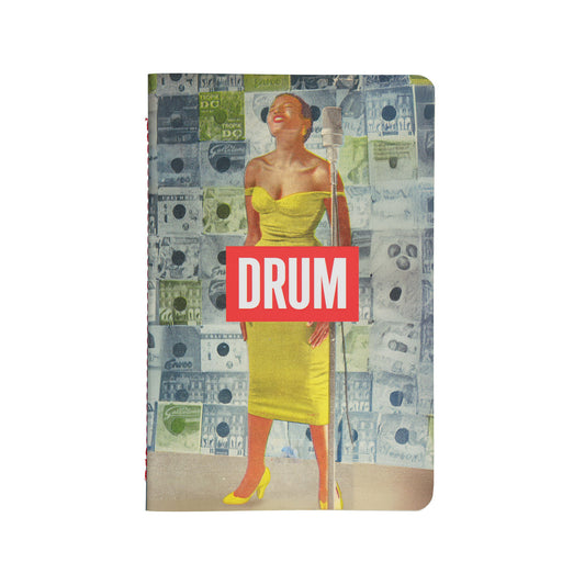 Soft Cover Notebook with a design of a Miriam Makeba in a yellow dress with the DRUM Logo