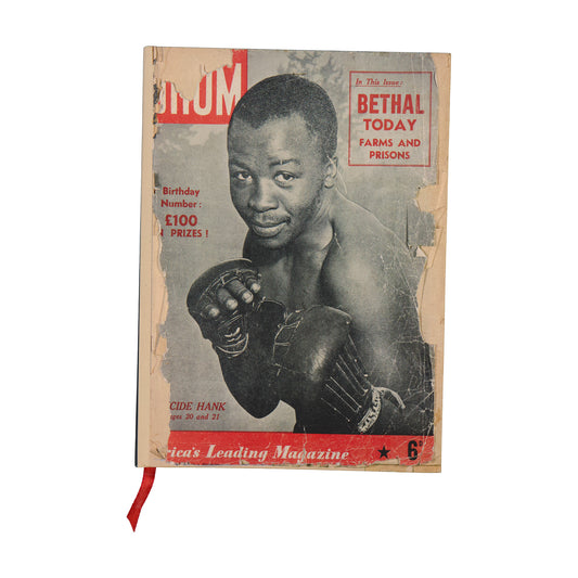 Vintage-style magazine cover on a notebook with a boxer on the front