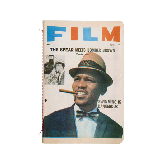 Vintage magazine cover with a man smoking a cigar and text about 'Film' and 'Bomber Brown'.