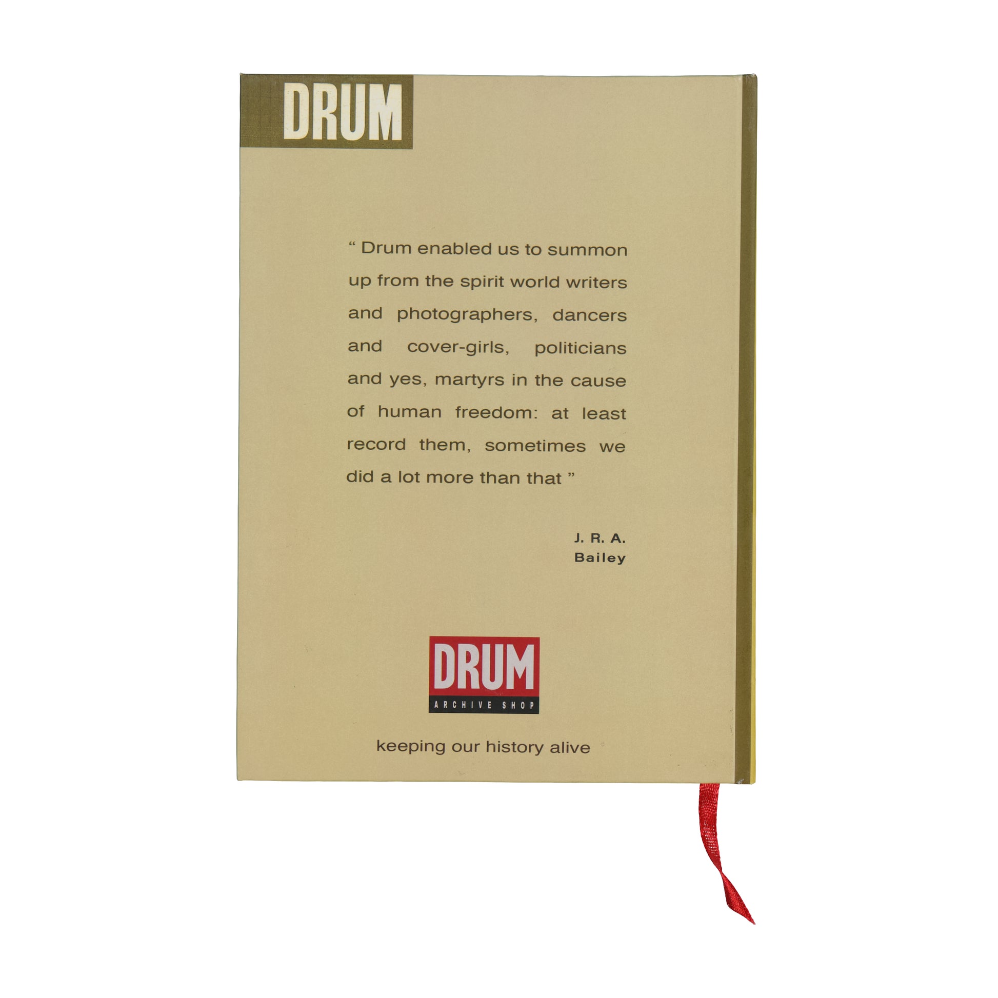 Book with text and DRUM logo on a beige background