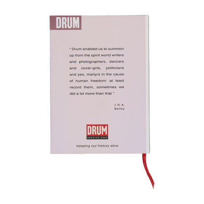 Book with text and 'DRUM' branding on a white background