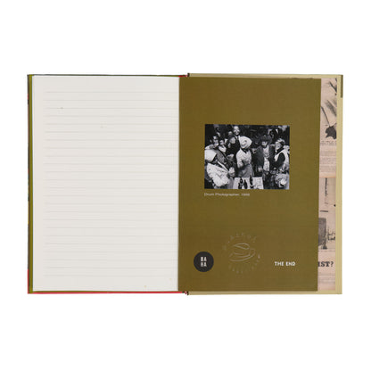 Open notebook with lined pages and a vintage-style cover featuring a black and white photo and text.
