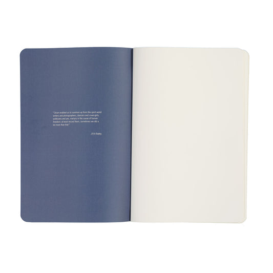 Open notebook with blue and white pages on a white background