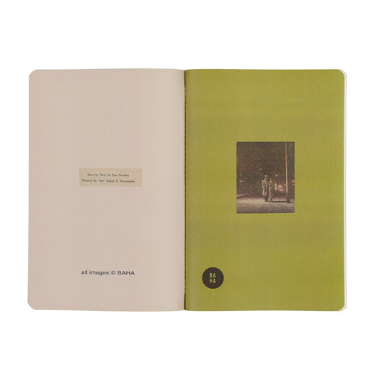 Open book with a green cover and beige interior on a white background
