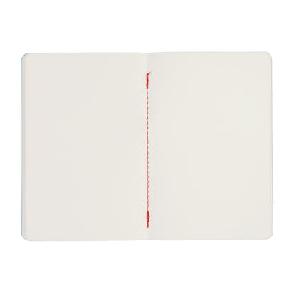 White notebook with red stitching on a white background