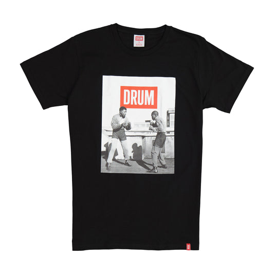 Black t-shirt with a graphic of Nelson Mandela and 'DRUM' text on a white background