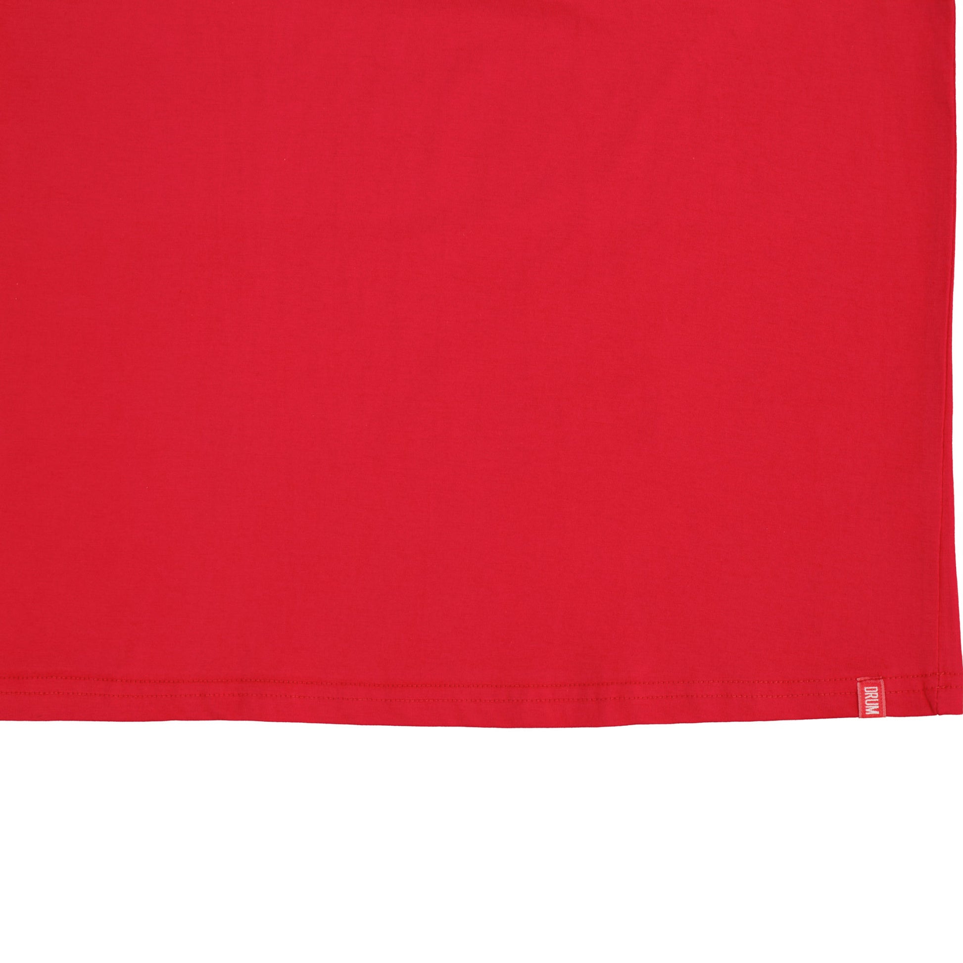 Close-up of a red fabric with a brand label on a white background