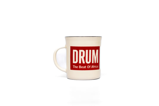 Mug with 'DRUM The Beat Of Africa' text on a white background