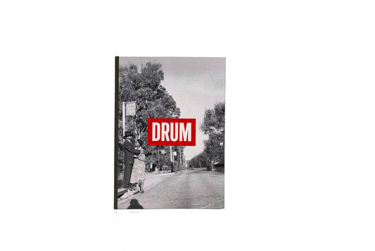 Notebook titled 'DRUM' with a black and white photo of a Sophiatown scene on the cover.
