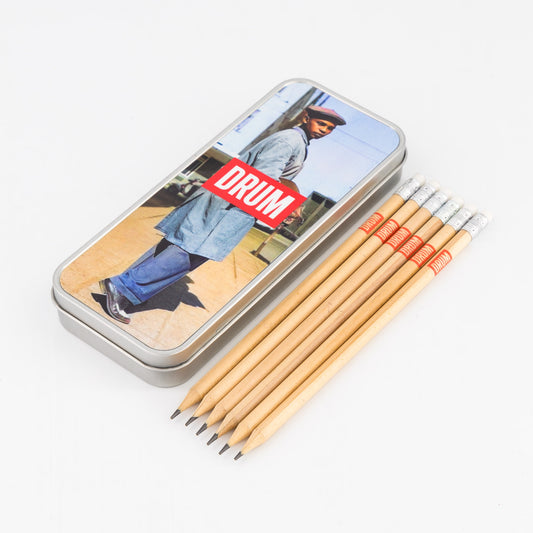 DRUM branded pencil set with pencils and tin on a white background