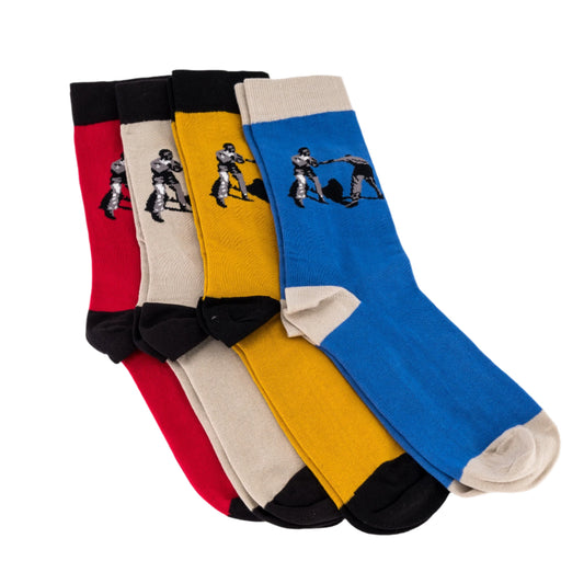 Set of four socks in red, stone-white, yellow, and blue with graphic designs on a white background