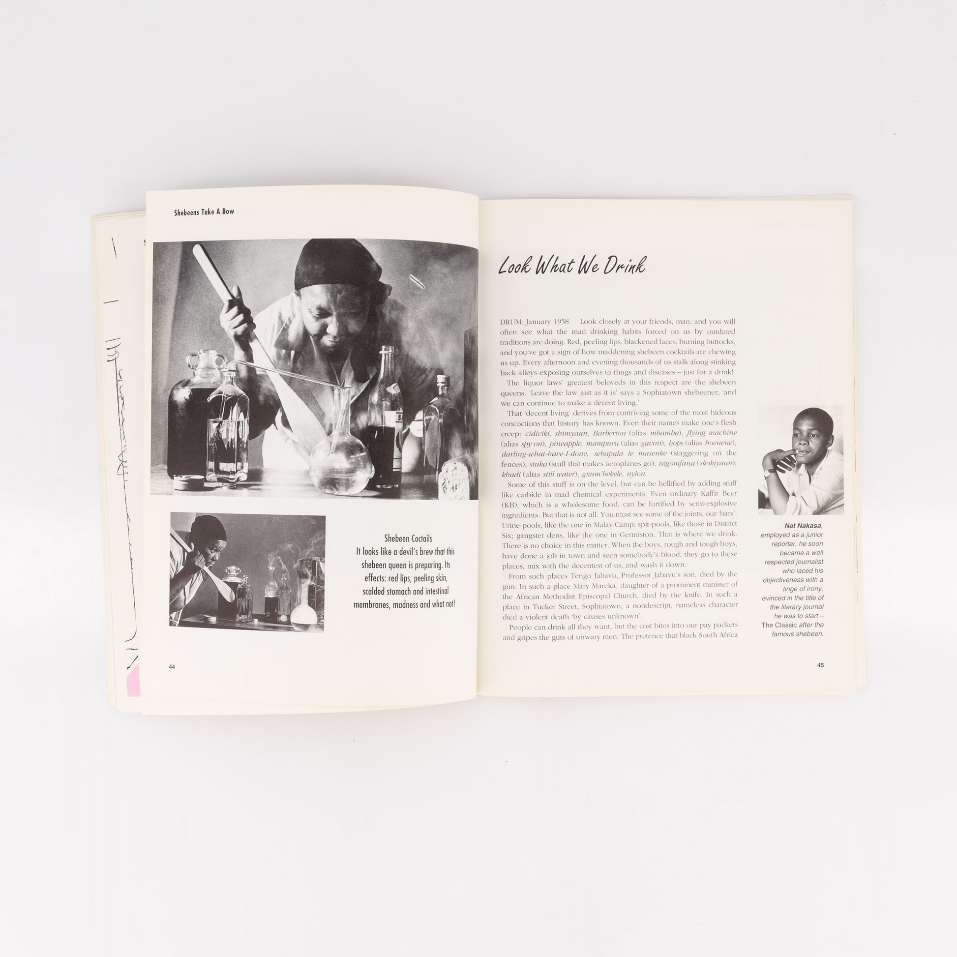 Open book with black and white photos and text on a white background