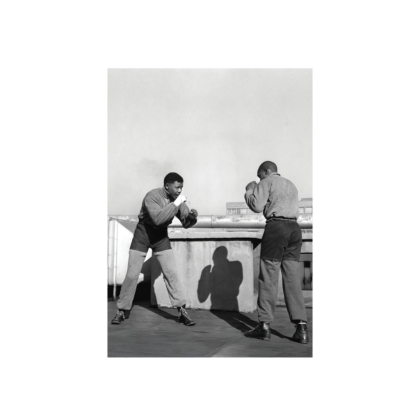 Nelson Mandela  sparring on a rooftop.