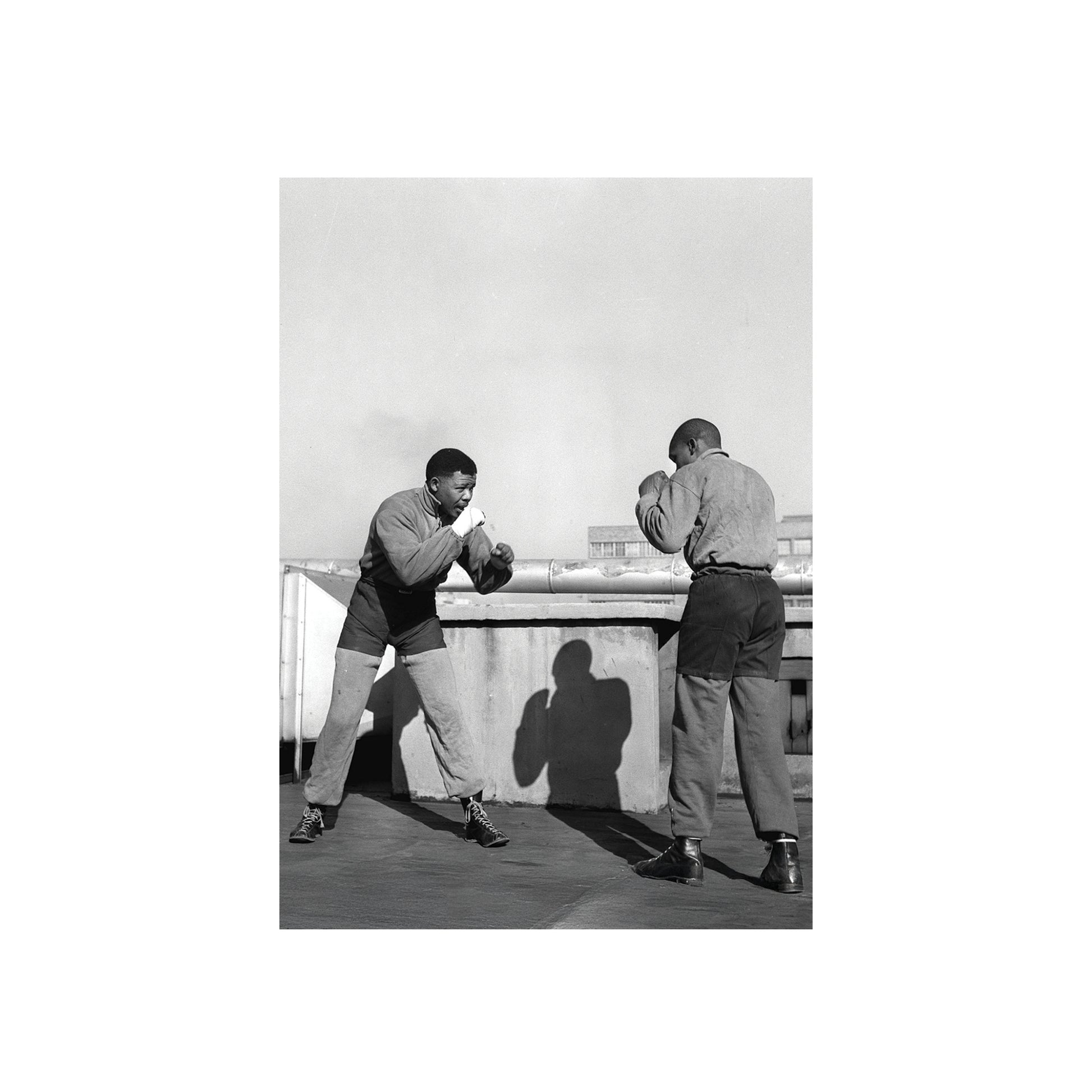 Nelson Mandela  sparring on a rooftop.