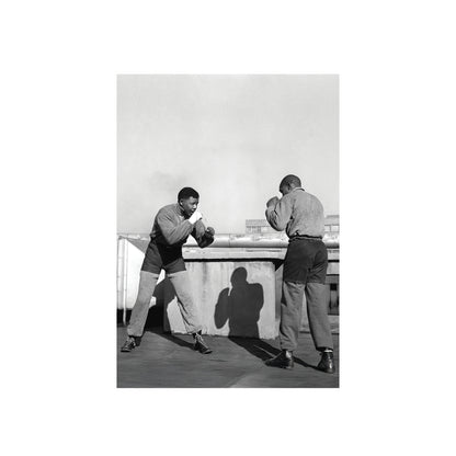 Nelson Mandela  sparring on a rooftop.