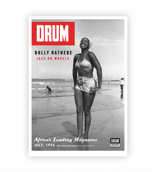 Vintage magazine cover on a poster featuring a woman on a beach with 'DRUM' branding